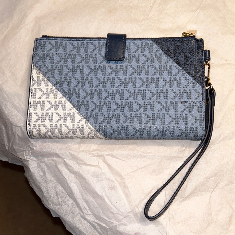 Michael Kors women’s double zip wristlet, gold tone hardware. Never used.